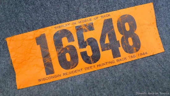 1944 Wisconsin Resident Deer Hunting Back Tag is numbered 16548. Measures 9-1/2" x 3-1/4". 3/4" tear