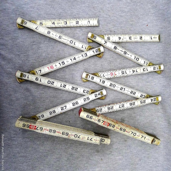 Two Lufkin red end extendable rulers. One ruler has a break near the middle