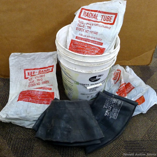 Five gallon bucket full of radial tire tubes, inner tubes, non-radial tubes. Most with new