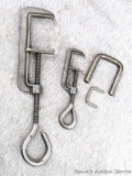 Large and small animal trap setting clamps with U-shaped pieces. Smaller opens to nearly 2-1/4