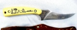Schrade+ USA Scrimshaw fixed blade hunting knife with a leather sheath. Model 502SC, other side of