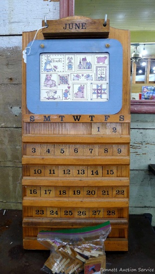 Cute wooden calendar, measures 22'' x 11'' and comes with holiday pieces, special date blocks, and