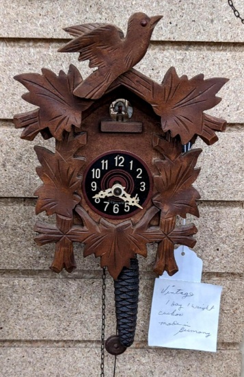 Vintage one weight cuckoo clock has face marked Germany. Seller notes it's a 1 day clock. Cabinet in