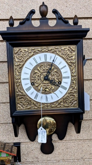 German made wall clock with key, Seller notes runs. Cabinet in good condition, about 20" tall
