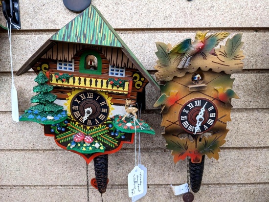 Two little cuckoo clocks. Seller notes that one needs the hour hand and bellow tops, other needs