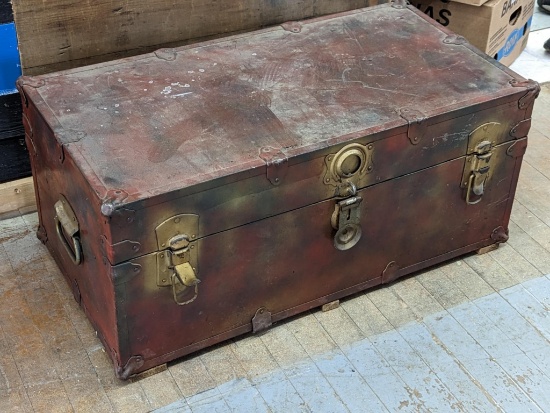 Vintage footlocker trunk is about 31" x 16" x 14" high. Metal on bottom is rusted but Interior layer