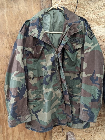 U.S. Military cold weather coat has an Intelligence and Security Command patch on the left shoulder.