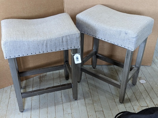 Two 24" tall stools with nice cushy tops. Both stools are in good condition with some use marks and