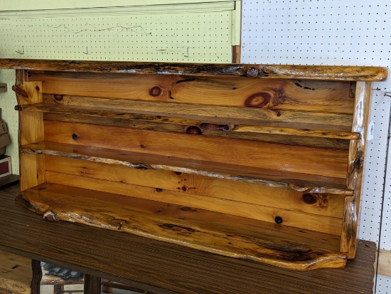 Northwoods style shelf is about 66" x 27" x 11" at deepest. In good condition, matches tables in