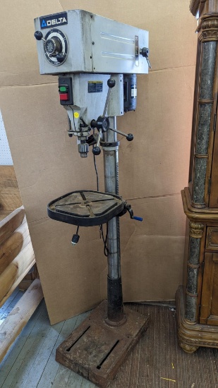 Delta drill press with a speed adjustment. The drill runs smoothly, has a high and low range,