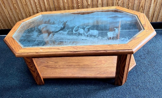 Oak End Table with elk etched glass top; roughly 2ftx4ft about 18 in high