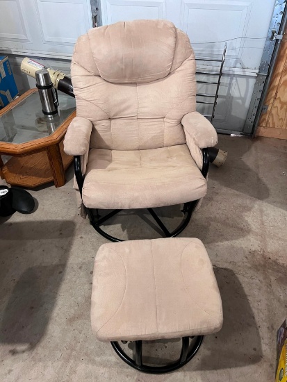 Tan swivel rocking chair with footstool, magazine pouch on side, no stains rips or tears
