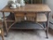 Wooden and wicker covered porch table; measures 42