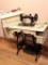 Antique treadle sewing machine with cabinet, wooden cabinet cover and a bunch of notions. Graphics