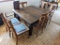 Wooden farm table with 6 matching chairs; measures 42