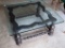 Square coffee table with the retro chunky wooden legs and glass top; measures 40