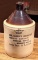 Western Stoneware one gallon advertising jug is marked Butter Color Rennet Extract from Chr.