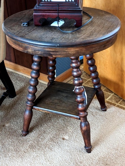 Charming side table is about 20" wide and 22" tall. A little wobbly but in overall good condition.
