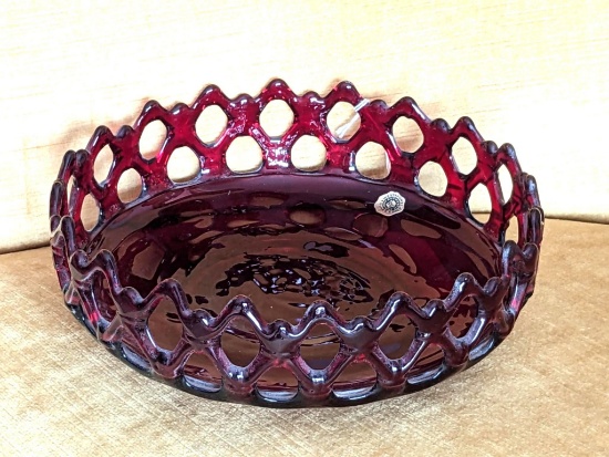 Westmoreland ruby red pierced glass bowl is about 9" x 3". In overall good condition with