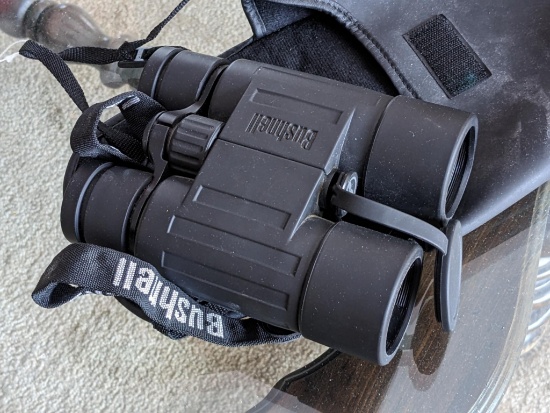 Bushnell Banner binoculars with case; measures 6-1/2" long. 10x42, 305 FTFOV.