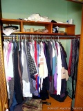 Men's clothing including button down shirts, polo shirts, jacket, sweater, a couple pairs of jeans,