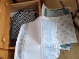 Drawer full of extra blankets, placemats and more.