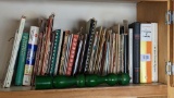 Cookbooks galore and a tall pepper grinder, cookbooks include AFS Chapter Rib Lake 1977, Zion
