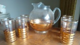 Gold striped ball pitcher with six matching cups. Pitcher stands 8-1/2