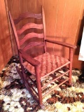 Cute little rocking chair with woven seat measures 15