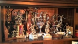 Quantity of bowling trophies, tallest is 15
