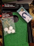 Ultimate Putting System 9' putting green with electric ball return, a few practice golf balls, and a