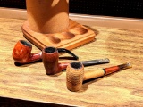 Two imported briar pipes and a corncob pipe with humidor/stand and some tobacco. Briar pipes are Dry