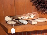 Nice array of things including sea shells, layered and porous rocks, railroad spikes, other rocks.