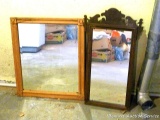 Two framed mirrors. Beveled glass mirror measures approx. 27