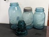 Strong shoulder and other blue Ball jars, largest is 1/2 gallon. Green telegraph insulator.
