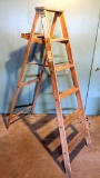 Wooden 6' folding ladder, w/ paint tray. Could use some tightening up.