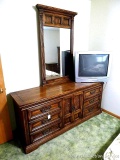 Quality made dresser with mirror has six drawers, plus three more hidden behind cabinet-style door -