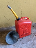 2.5 gallon gas tote with a funnel. The spout has an aftermarket plug but other than that its in good