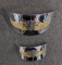 Two Harley Davidson Motorcycle headlight visors appear like new with some dirt on back sides.