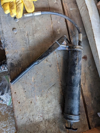 No shipping. Plews grease gun, measures 16" over body and 12" long hose.