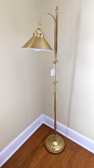 Adjustable height gold toned floor lamp is in good condition. Works and raises to 62".