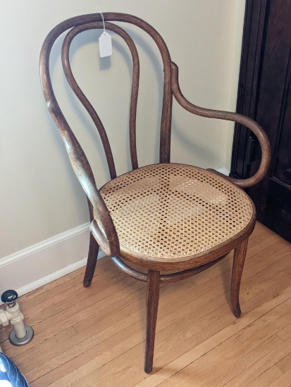 Really neat antique bentwood chair was made by wetting or steaming and bending pieces of wood. In