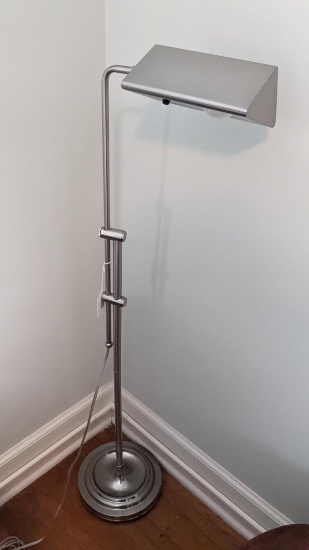Modern adjustable height floor lamp extends to 53" tall. Bulb attachment is loose but lamp is in