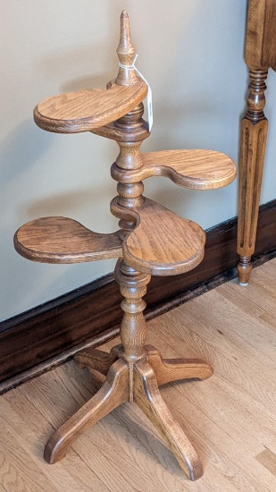 Plant stand is 33" tall and has several shelves for multiple plants.