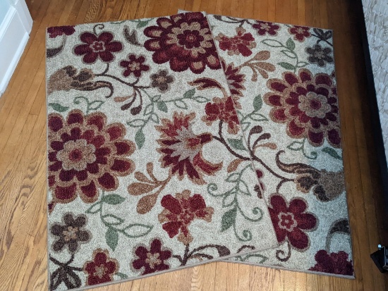 Matching 30" x 46" rugs are in good condition and have built-in rug grips on backs. Comes from a