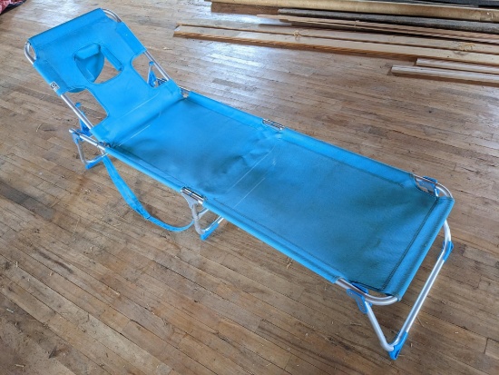 Upstairs, bring help. Nice lounge chair with face hole; measures 74" x 22". Matches lot 884.