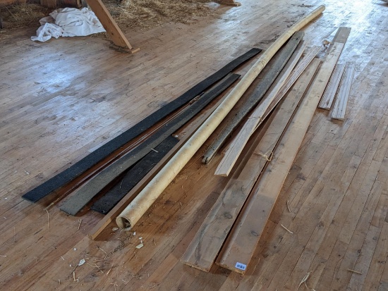 Upstairs, bring help. Various pieces of wood trim and other scrap pieces including a 90" curtain rod