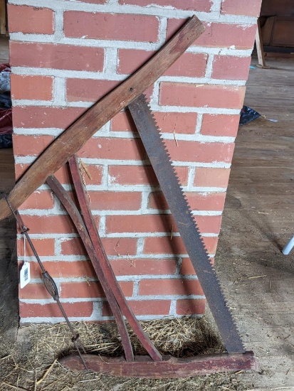 Upstairs, bring help. Antique buck saw with original parts; largest measurement is 37", blade