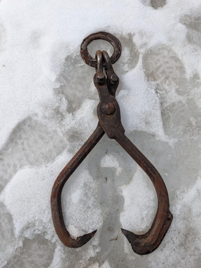 Skidding tongs measure 26" long overall, has a 5" hand forged hoop.