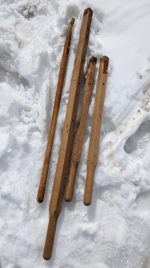 Pair and a half of wheel barrow handles, plus a pitch fork handle.